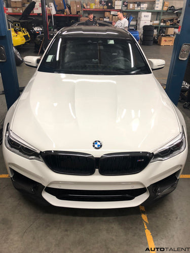 Alpine White BMW F90 M5 with Akrapovic Exhaust + M Performance Carbon Fiber