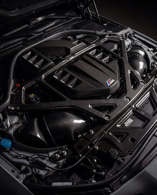 BMW S58 engine bay with aftermarket carbon intake — G80 M3 G82 M4 build guide