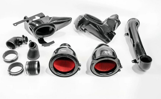 eventuri carbon fiber intake system laid out with white background 