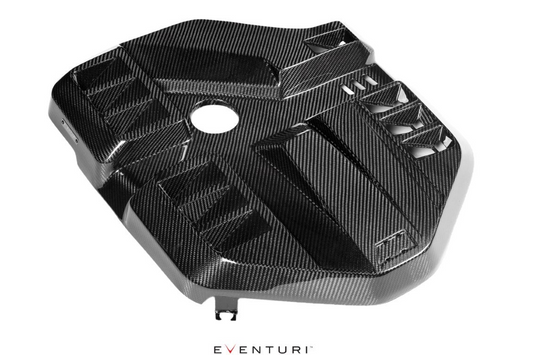 a carbon fiber engine cover from eventuri on white background