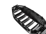 A close up view of AUTOTECKNIC PAINTED GLAZING BLACK DUAL-SLAT FRONT GRILLE - G20 3-SERIES LCI 2022+ with white background