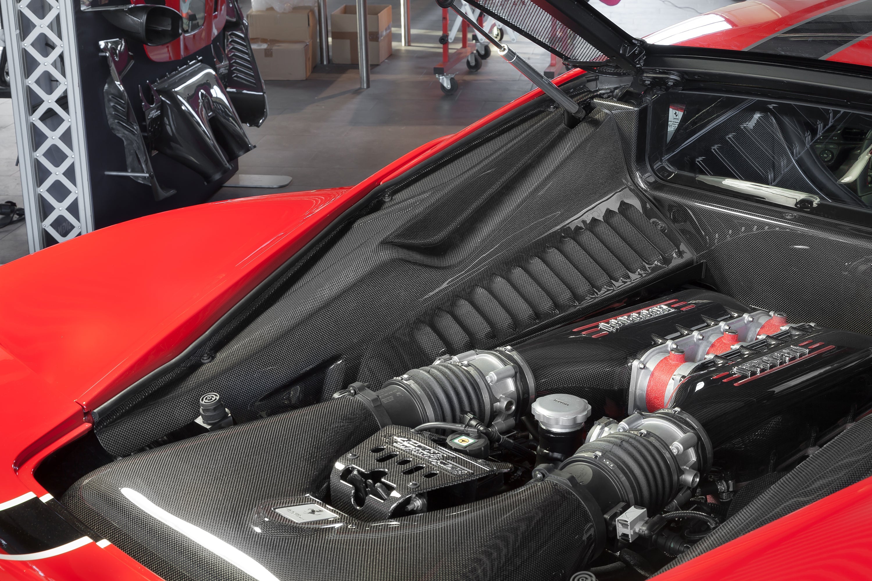 Ferrari 458 Speciale engine bay with Capristo carbon fiber lock cover installed