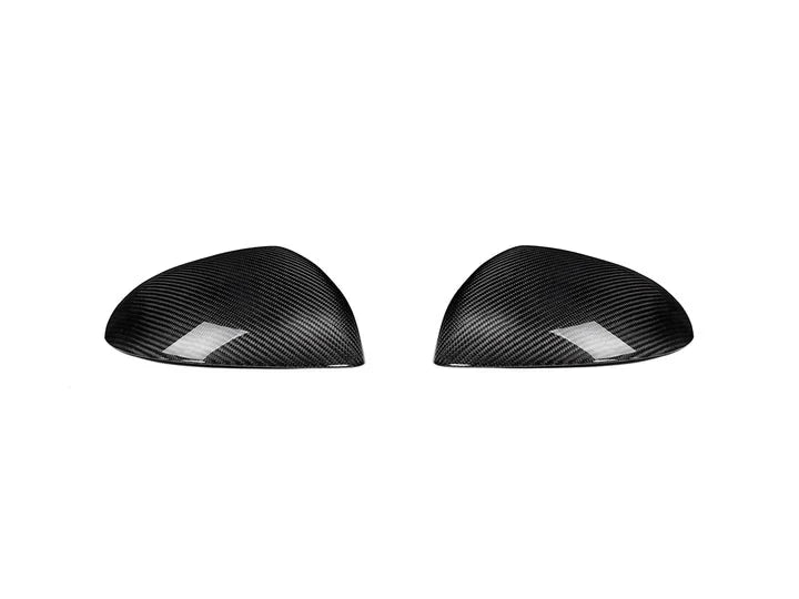 A front view of AUTOTECKNIC REPLACEMENT DRY CARBON MIRROR COVERS - MERCEDES-BENZ W206 C-CLASS 2022+ with white background
