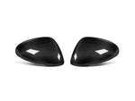 A front view of AUTOTECKNIC REPLACEMENT DRY CARBON MIRROR COVERS - PORSCHE 95B MACAN 2014+ with white background