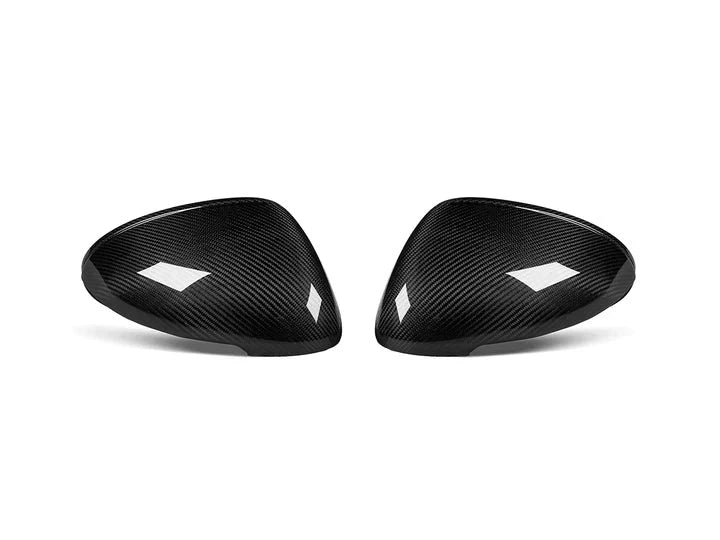 A front view of AUTOTECKNIC REPLACEMENT DRY CARBON MIRROR COVERS - PORSCHE 95B MACAN 2014+ with white background