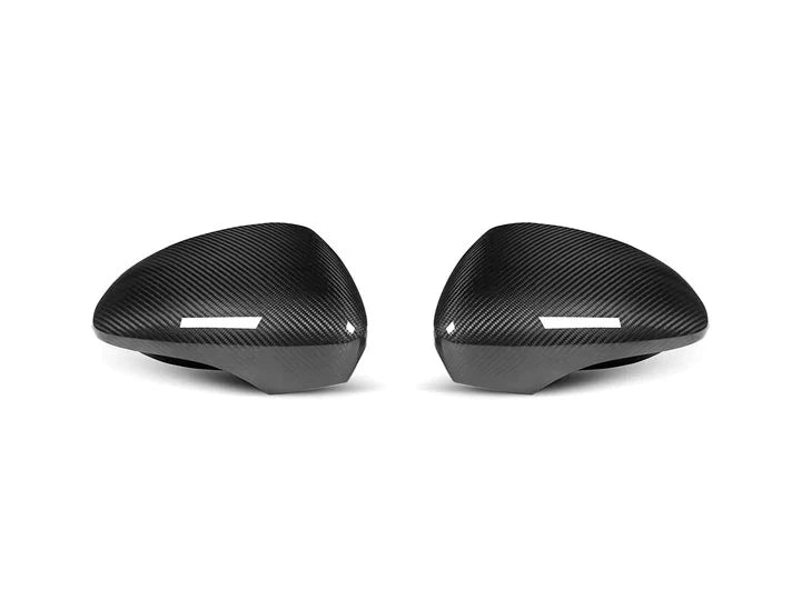 A front view of AUTOTECKNIC REPLACEMENT DRY CARBON MIRROR COVERS - PORSCHE 971 PANAMERA 2017-2023 with white background