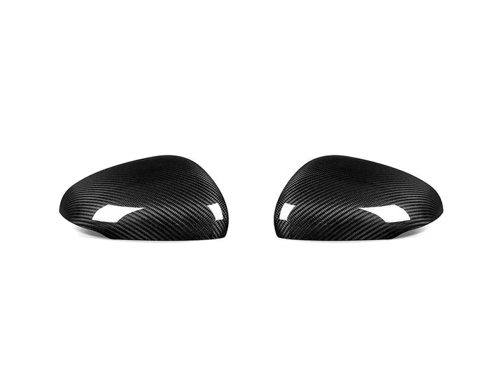 A front view of AUTOTECKNIC REPLACEMENT DRY CARBON MIRROR COVERS - MERCEDES-BENZ V177 | W177 A-CLASS 2018+ with white background