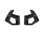 A front view of AUTOTECKNIC DRY CARBON FRONT BUMPER AIR VENT SET - BMW F97 X3M | F98 X4M LCI 2022+ with white background