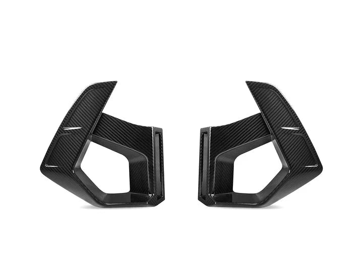 A front view of AUTOTECKNIC DRY CARBON FRONT BUMPER AIR VENT SET - BMW F97 X3M | F98 X4M LCI 2022+ with white background