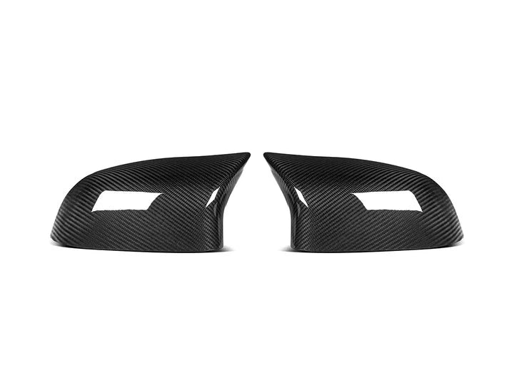 A front view of AUTOTECKNIC M-INSPIRED DRY CARBON MIRROR COVERS - BMW F25 X3 | F26 X4 | F15 X5 | F16 X6 2010-2019 with white background