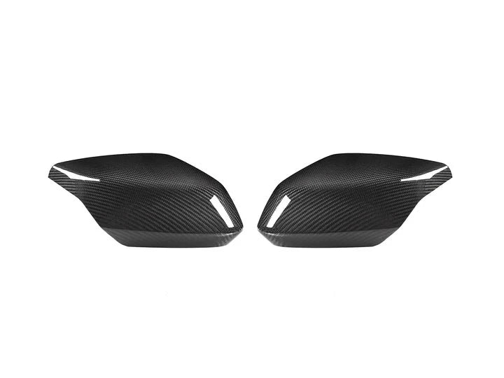 A front view of AUTOTECKNIC REPLACEMENT DRY CARBON MIRROR COVERS - CHEVROLET C8 CORVETTE 2020+ with white background