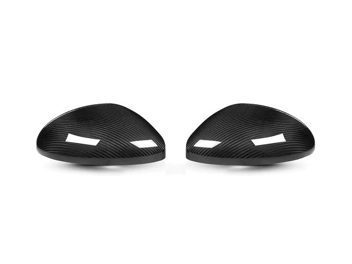 A front view of AUTOTECKNIC REPLACEMENT CARBON FIBER MIRROR COVERS - PORSCHE 718 CAYMAN | BOXSTER 2017-2023 with white background