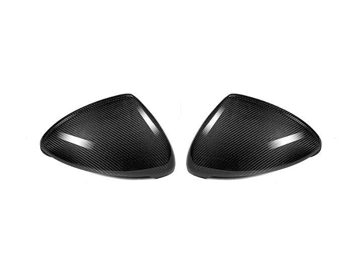 A front view of AUTOTECKNIC REPLACEMENT DRY CARBON MIRROR COVERS - PORSCHE 958.2 CAYENNE 2015-2018 with white background