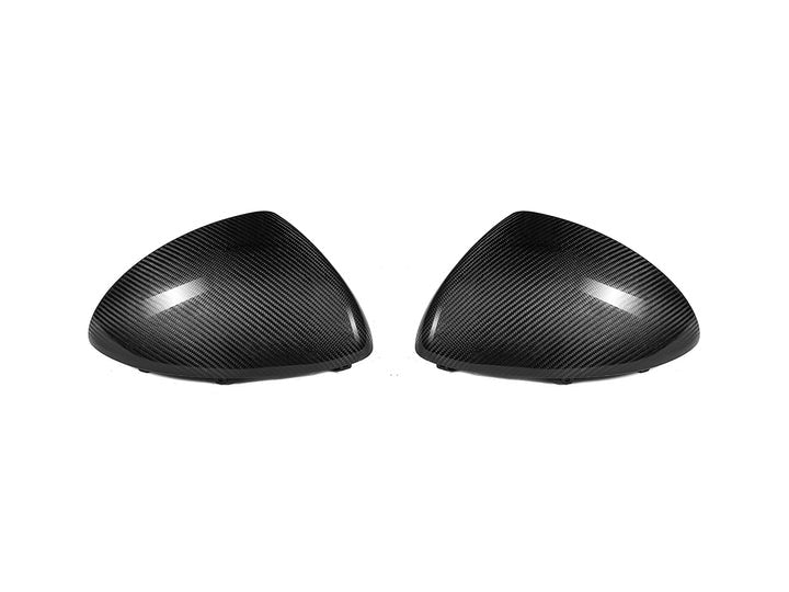 A front view of AUTOTECKNIC REPLACEMENT DRY CARBON MIRROR COVERS - PORSCHE 958 CAYENNE 2011–2014 with white background