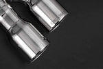 close view of Capristo Exhaust ECE Valved Mufflers w/ Stainless Steel Tips for BMW 550i F10 2010-2017 with black background