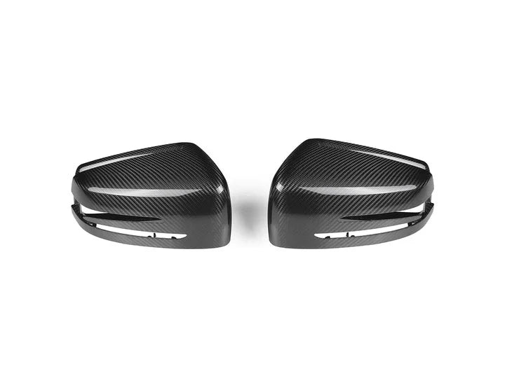 A front view of AUTOTECKNIC REPLACEMENT VERSION II DRY CARBON MIRROR COVERS - MERCEDES-BENZ VEHICLES 2009+ with white background