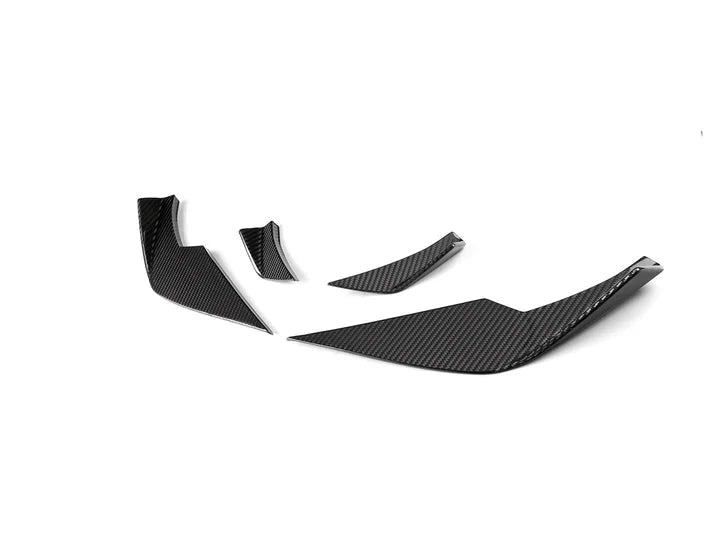 A side wide view of AUTOTECKNIC FRONT BUMPER DRY CARBON CORSA CANARD SET - BMW G80 M3 | G82 M4 2021+ with white background