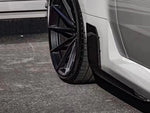 A close up view of AUTOTECKNIC DRY CARBON SIDE SKIRT WINGLET SET - BMW G87 M2 2023+ fitted on a car