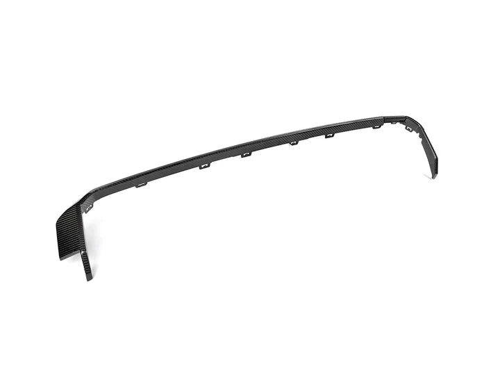 A front wide side view of AUTOTECKNIC DRY CARBON REAR DIFFUSER TRIM SET Gloss Finish - BMW G80 M3 | G82/ G83 M4 2021+ with white background