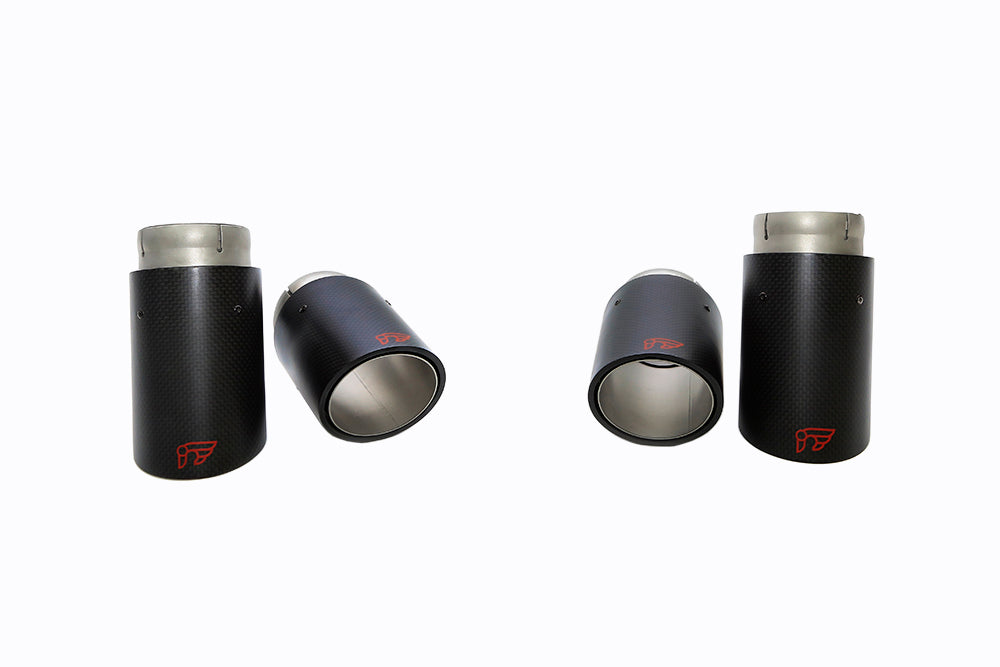 A front wide view of the carbon fiber tips of the IPE SS Cat-Back Exhaust System with Remote Control for Audi S3 8V Sedan 2013-2020 with white background