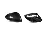 A front and back view of AUTOTECKNIC REPLACEMENT DRY CARBON MIRROR COVERS - PORSCHE 95B MACAN 2014+ with white background