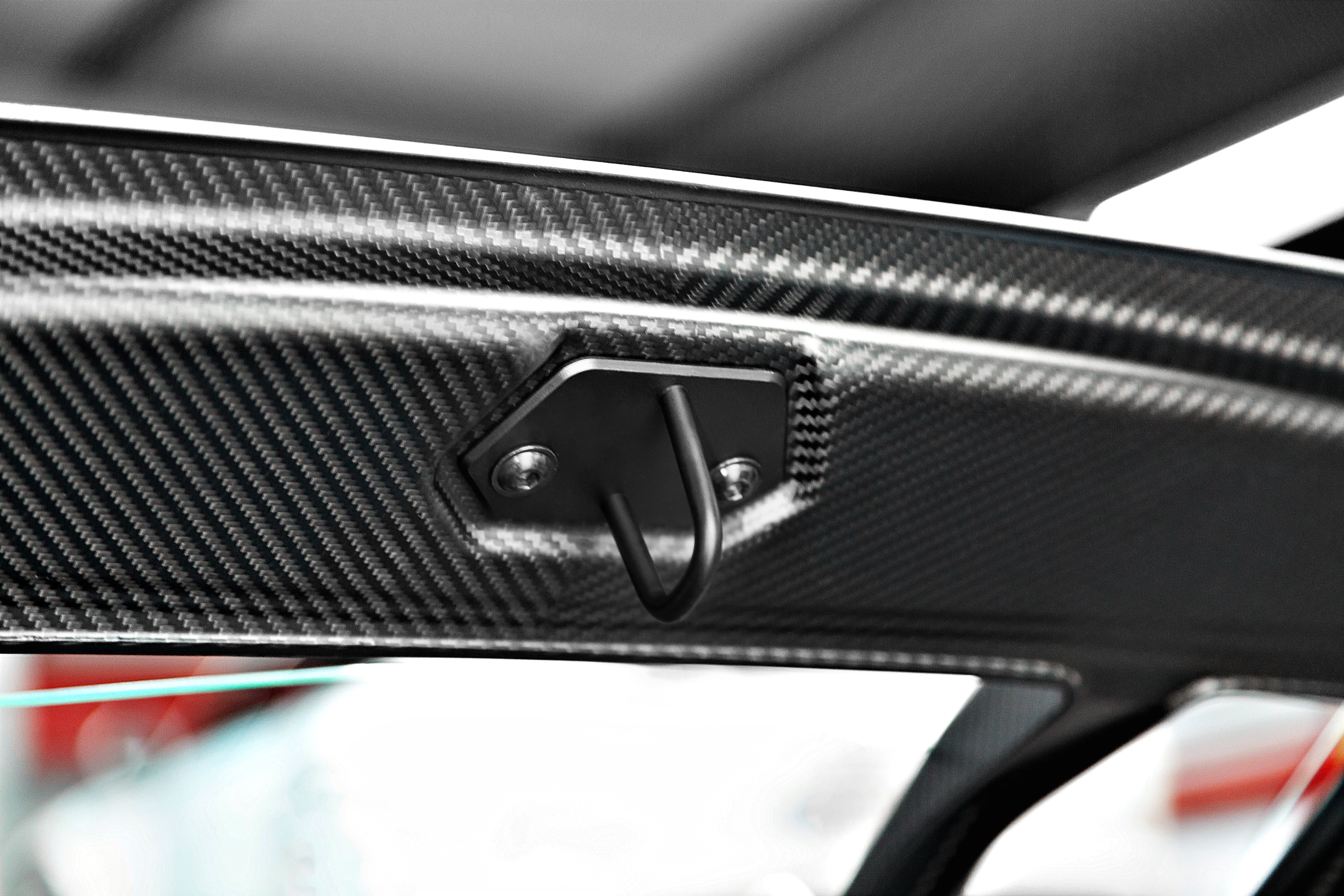 Close-up of carbon weave and latch on Capristo Huracan bonnet
