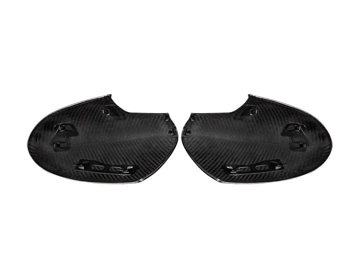 A back view of AUTOTECKNIC REPLACEMENT DRY CARBON MIRROR COVERS - TOYOTA GR86 | SUBARU BRZ 2022+ with white background