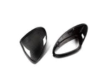 A top view of AUTOTECKNIC REPLACEMENT DRY CARBON MIRROR COVERS - PORSCHE 958.2 CAYENNE 2015-2018 with white background