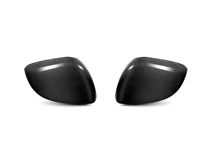 A back view of AUTOTECKNIC REPLACEMENT DRY CARBON MIRROR COVERS - MERCEDES-BENZ W206 C-CLASS 2022+ with white background