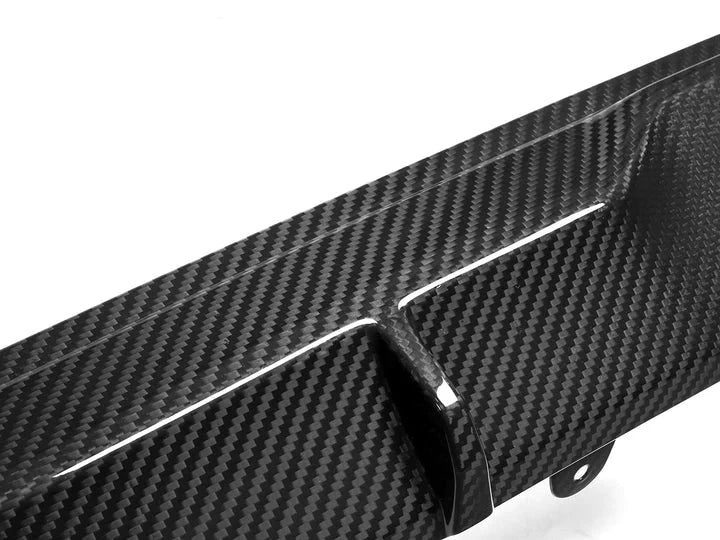 A close up view of AUTOTECKNIC DRY CARBON PERFORMANTE REAR DIFFUSER - BMW G20 M340I PRE-LCI 2019-2022 with white background