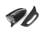 A side view of AUTOTECKNIC M-INSPIRED CARBON FIBER MIRROR COVERS - BMW G14/ G15/ G16 8-SERIES 2019+ with white background