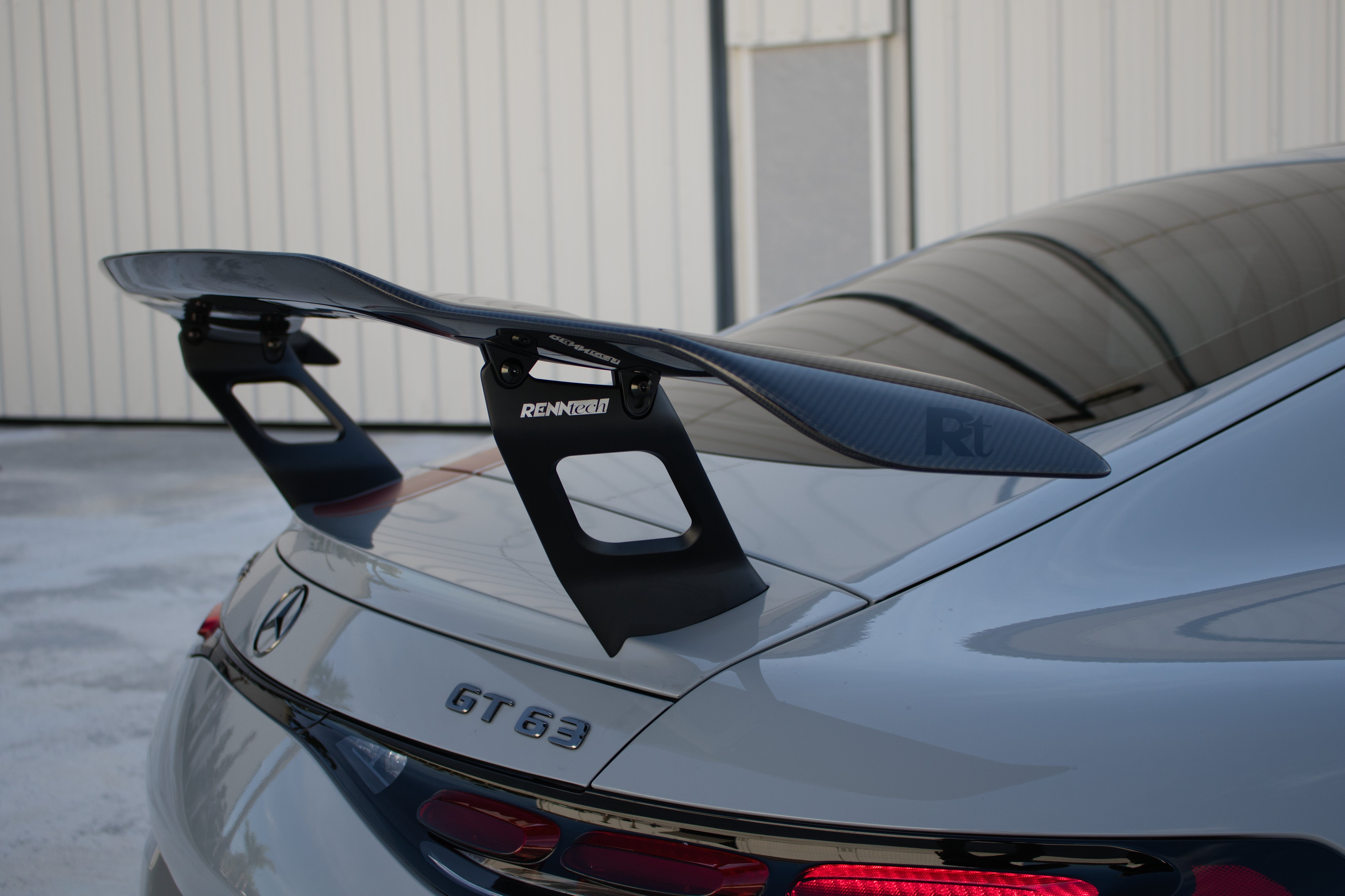 Carbon rear wing mounted on the decklid from behind - Carbon Fiber Rear Wing for the 2024-2026 AMG GT 55 / GT 63 Coupe