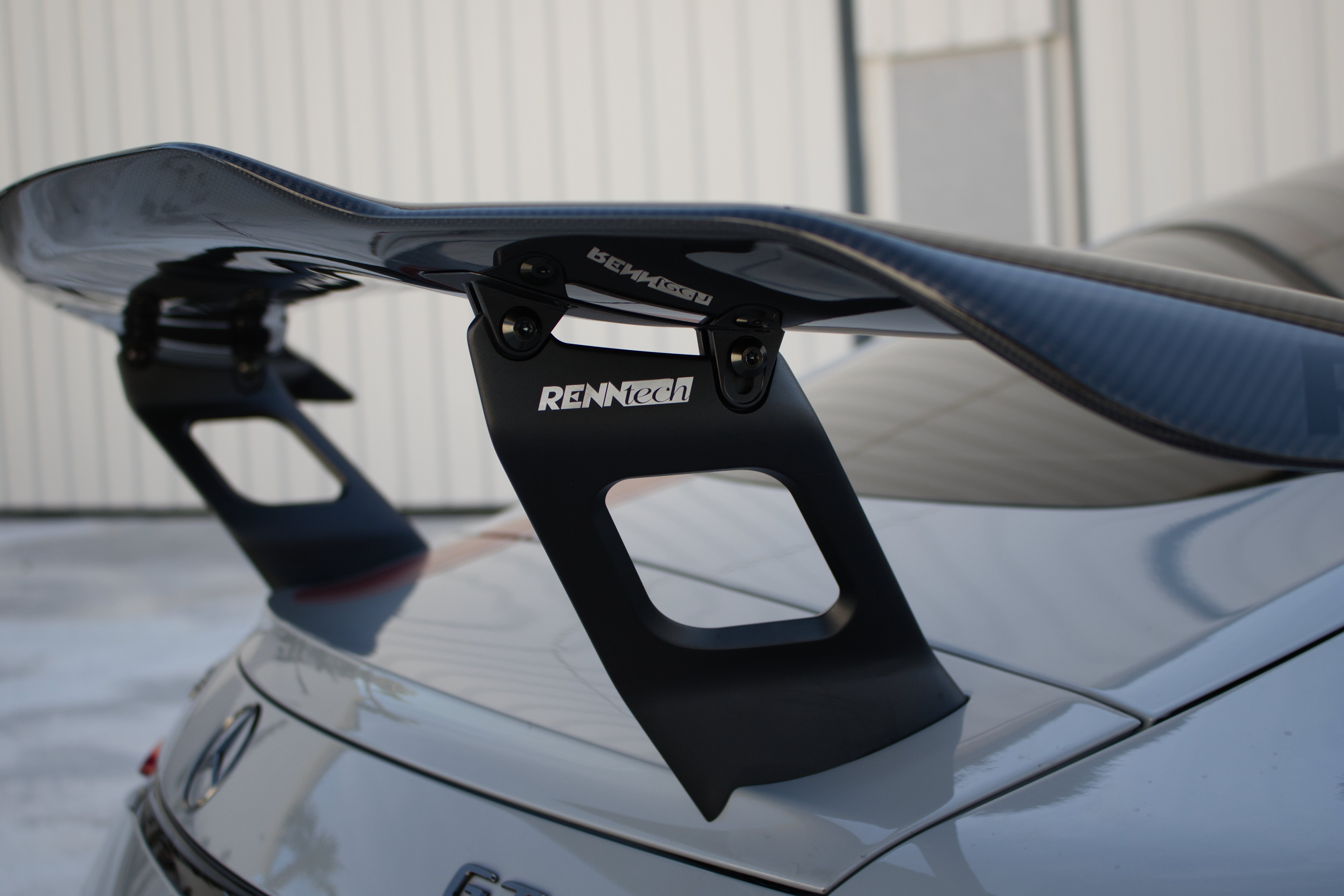 Carbon rear wing uprights from the side - Carbon Fiber Rear Wing for the 2024-2026 AMG GT 55 / GT 63 Coupe