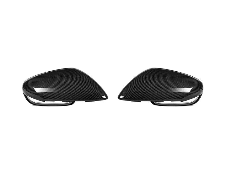 A back view of AUTOTECKNIC REPLACEMENT DRY CARBON MIRROR COVERS - PORSCHE 9J1 TAYCAN 2019+ with white background