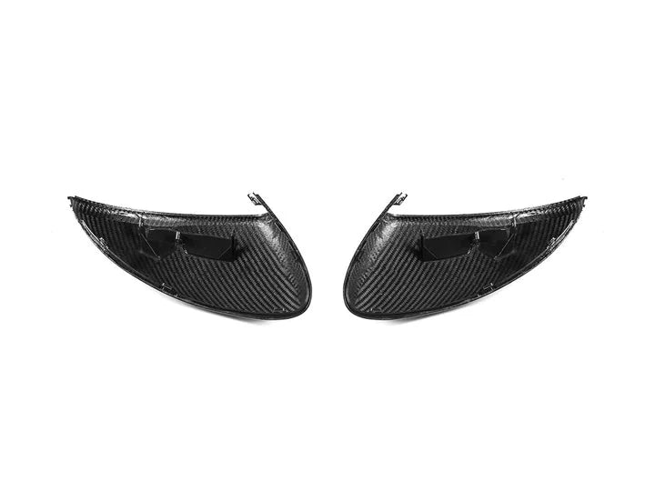 A back view of AUTOTECKNIC REPLACEMENT DRY CARBON MIRROR COVERS - PORSCHE 958 CAYENNE 2011–2014 with white background