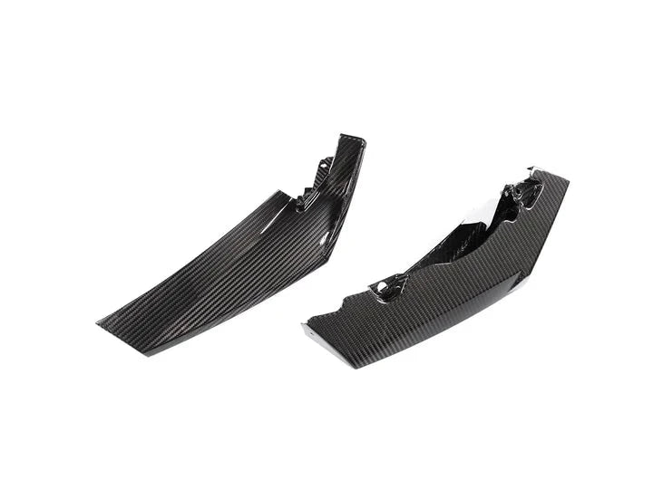 A close up view of parts of AUTOTECKNIC DRY CARBON COMPETITION SPORT FRONT AERO LIP - BMW G80 M3 | G82/ G83 M4 2021+ with white background