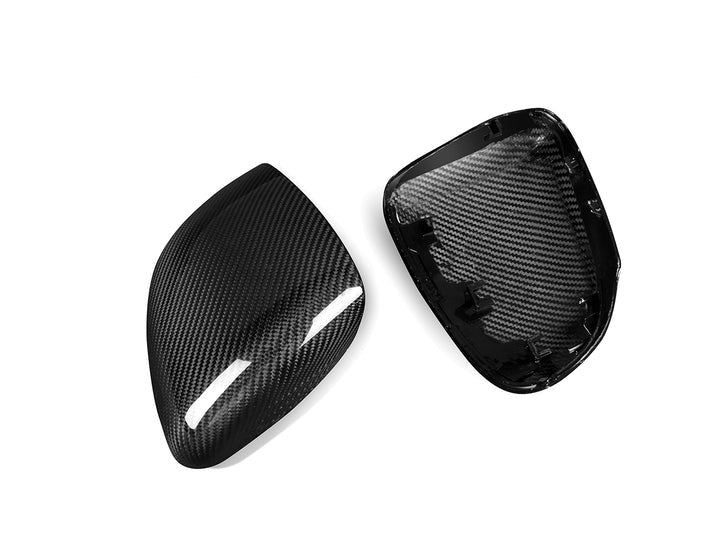 A front and back view of AUTOTECKNIC REPLACEMENT DRY CARBON MIRROR COVERS - MERCEDES-BENZ V177 | W177 A-CLASS 2018+ with white background
