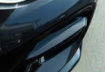 A top close up view of AUTOTECKNIC CARBON FIBER FRONT BUMPER TRIM SET - BMW G01 X3 | G02 X4 M40I PRE-LCI 2017-2021 fitted on a dark blue car