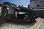 A close up view of TECHART Aero Wings in Glossy Carbon Fiber Porsche 991.2 Turbo from MY17on a black Porsche