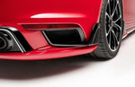 A close up view of TECHART Rear Bumper Air Outlet Porsche 992 Turbo /S fitted on a red car