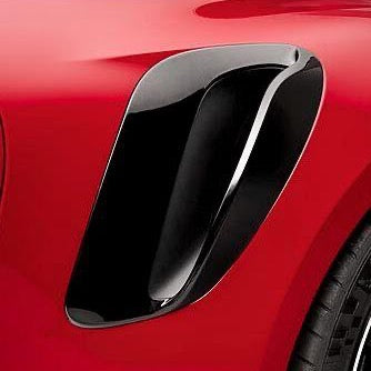 A close up view of TECHART Carbon Glossy Side Air Intake Porsche 992 Turbo /S fitted on a red car