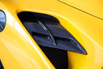 Capristo carbon fiber side air intake panel on a yellow Ferrari 488, close-up