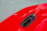 Close-up of Capristo carbon front bonnet air vent on a red F8