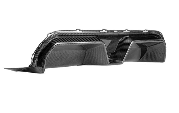 A side wide view of AUTOTECKNIC DRY CARBON COMPETITION SPORT REAR DIFFUSER - BMW F90 M5 2017+ with white background