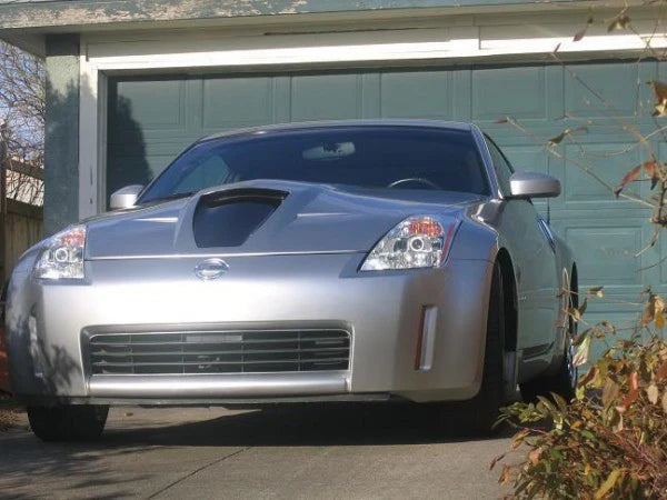 wide view of Stillen Power Hood [Fiberglass Series 2] for Nissan 350Z [Z33] 2003-2006 fitted inside a car
