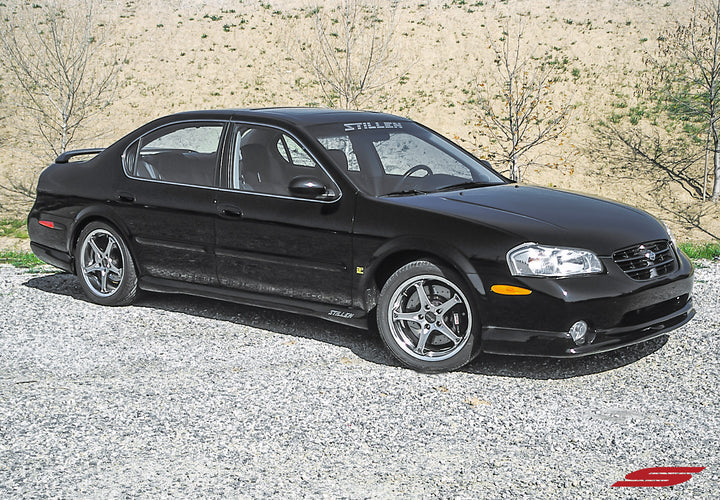 wide view of Stillen Front Lip Spoiler [Classic] for Nissan Maxima 2000-2001 fitted inside a car