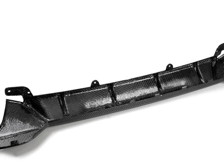 A back close up view of AUTOTECKNIC DRY CARBON PERFORMANTE REAR DIFFUSER - BMW G20 M340I PRE-LCI 2019-2022 with white background