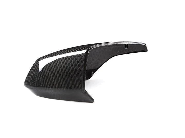 A view of one of the AUTOTECKNIC REPLACEMENT DRY CARBON MIRROR COVERS - CHEVROLET C8 CORVETTE 2020+ with white background