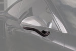 A close up view of TECHART Side Mirror Base (L/R) Carbon "glossy" Sport Design for Porsche 991/ 981 with the mirror base highlighted