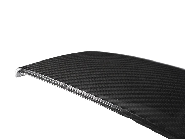 A close up view of AUTOTECKNIC REPLACEMENT DRY CARBON MIRROR COVERS - CHEVROLET C8 CORVETTE 2020+ with white background